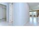 Hallway view leading to the open living area, stairs, and bedrooms at 17805 Everlong Dr, Land O Lakes, FL 34638