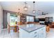 Open-concept kitchen with a large island and adjacent dining area at 17805 Everlong Dr, Land O Lakes, FL 34638