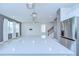 Open kitchen island with gray counter tops and view into the living room, creating an open floor plan at 17805 Everlong Dr, Land O Lakes, FL 34638