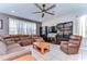 Inviting living room showcasing tile floors and a large sectional sofa at 17805 Everlong Dr, Land O Lakes, FL 34638