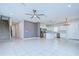 Large open living space connecting living, dining, and kitchen with stainless appliances at 17805 Everlong Dr, Land O Lakes, FL 34638