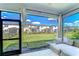 Screened in patio with outdoor furniture overlooking a well-maintained lawn and fenced backyard at 17805 Everlong Dr, Land O Lakes, FL 34638
