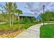 Charming exterior view of the swim club featuring lush landscaping and inviting architecture at 17805 Everlong Dr, Land O Lakes, FL 34638