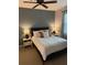 Relaxing bedroom with a ceiling fan, neutral walls, and a comfortable bed at 1810 E Palm Ave # 7104, Tampa, FL 33605