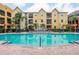 Large swimming pool and lounge area offer a refreshing retreat with well-maintained landscaping and building views at 1810 E Palm Ave # 7104, Tampa, FL 33605