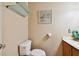 Cozy bathroom featuring neutral walls, toilet, floating shelves and framed wall art at 20145 Bay Cedar Ave, Tampa, FL 33647