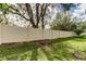 Lush backyard featuring a tall privacy fence and green grass at 2153 Broadway View Ave, Brandon, FL 33510
