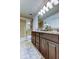 Large bathroom featuring a vanity with dual sinks and a glass-enclosed shower at 2153 Broadway View Ave, Brandon, FL 33510