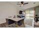 Bright living room with sliding glass doors, neutral walls, and a modern ceiling fan at 2153 Broadway View Ave, Brandon, FL 33510