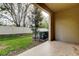 Covered patio overlooking a spacious backyard with a well-maintained lawn and privacy fence at 2153 Broadway View Ave, Brandon, FL 33510