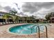 Community swimming pool surrounded by lounge chairs at 2153 Broadway View Ave, Brandon, FL 33510