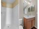 Clean bathroom offers a single vanity, shower and toilet at 2156 Deltona Blvd, Spring Hill, FL 34606