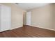 Bedroom with wood-look flooring, neutral paint, and closet at 2156 Deltona Blvd, Spring Hill, FL 34606