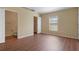 Neutral bedroom features an en-suite bathroom, window, and closet at 2156 Deltona Blvd, Spring Hill, FL 34606