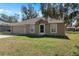 Charming home with a well-maintained lawn and inviting facade at 2156 Deltona Blvd, Spring Hill, FL 34606