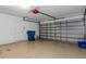 Spacious garage with white walls, concrete floor, and white door at 2156 Deltona Blvd, Spring Hill, FL 34606