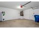 Attached garage with water heater, garage door opener, and utility door at 2156 Deltona Blvd, Spring Hill, FL 34606
