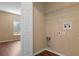 Laundry area with hook-ups, wood-look floors and shelves at 2156 Deltona Blvd, Spring Hill, FL 34606
