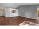 Open-concept living room boasts modern flooring, neutral paint, and ample natural light at 2156 Deltona Blvd, Spring Hill, FL 34606
