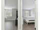 Split view of the bedroom featuring wood floors, closet and window at 24510 Mason Ct, Lutz, FL 33559