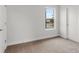 Carpeted bedroom features a street view, natural light, and a neutral color scheme at 2607 N 21St St, Tampa, FL 33605