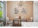 Dining room with modern chandelier, wood accent wall, and stylish decor for an inviting atmosphere at 2705 N Boulevard # 2, Tampa, FL 33602