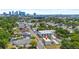 Aerial view of modern multi-unit home in a vibrant cityscape neighborhood, trees, and parking at 2808 N Florida Ave, Tampa, FL 33602