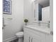 Stylish powder room featuring modern fixtures, a sleek sink, and a decorative accent wall at 2808 N Florida Ave, Tampa, FL 33602