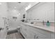 Modern bathroom features dual sinks, large mirror, and a glass-enclosed shower at 2808 N Florida Ave, Tampa, FL 33602