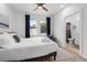 Bright bedroom with a view, a bed, and an adjoining bathroom at 2808 N Florida Ave, Tampa, FL 33602
