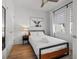 Bedroom with a queen size bed, ceiling fan, modern decor, and natural light at 2808 N Florida Ave, Tampa, FL 33602