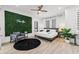 Stylish bedroom featuring a bed, greenery wall, decor, and natural light at 2808 N Florida Ave, Tampa, FL 33602