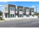 Modern townhome exterior features a gray and white facade with a white picket fence and street view at 2808 N Florida Ave, Tampa, FL 33602