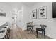 Bright hallway features modern art, leading to a cozy dining area, and connecting to other rooms at 2808 N Florida Ave, Tampa, FL 33602