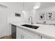 Modern kitchen with quartz countertops, stainless steel dishwasher and sink, and pendant lighting at 2808 N Florida Ave, Tampa, FL 33602