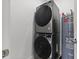 Stacked washer and dryer unit with water heater at 2808 N Florida Ave, Tampa, FL 33602