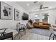 Inviting living room with modern artwork, comfortable seating, and a glass table for a sleek look at 2808 N Florida Ave, Tampa, FL 33602
