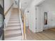 Bright entryway with wooden staircase and hardwood floors leading to other rooms at 2808 N Florida Ave, Tampa, FL 33602