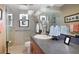 Bathroom featuring a glass-enclosed shower, vanity, and stylish decor, with a view of the outdoor pool area at 3416 Fairfield Trl, Clearwater, FL 33761