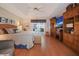 Spacious bedroom features tray ceilings, wood floors, and French doors to lanai at 3416 Fairfield Trl, Clearwater, FL 33761