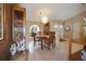 Inviting dining area featuring a chandelier and decorative display cabinet at 3416 Fairfield Trl, Clearwater, FL 33761