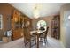 Elegant dining room with chandelier, display cabinet, and adjacent wine storage at 3416 Fairfield Trl, Clearwater, FL 33761