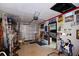 A well-organized garage with an epoxy floor, decor, and a door leading to the driveway, offering ample space at 3416 Fairfield Trl, Clearwater, FL 33761