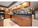 Well-lit kitchen with wood cabinets, counter space, and modern appliances at 3416 Fairfield Trl, Clearwater, FL 33761