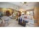 Bright living room featuring tile flooring and a decorative mirrored wall at 3416 Fairfield Trl, Clearwater, FL 33761