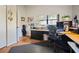 This office features laminate floors, dual workstations, natural light, and versatile storage for a productive workspace at 3416 Fairfield Trl, Clearwater, FL 33761