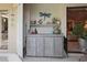 Outdoor kitchen with tiled countertop, shelving, storage, and charming decorative accents at 3416 Fairfield Trl, Clearwater, FL 33761