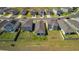 An aerial view of the property showcasing the well-manicured lawn and proximity to other homes at 35320 Spruce Knob Ct, Dade City, FL 33525