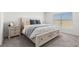 Comfortable bedroom features a large bed with drawers and a carpeted floor at 35320 Spruce Knob Ct, Dade City, FL 33525