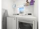 Bright laundry room with modern washer and dryer units at 35320 Spruce Knob Ct, Dade City, FL 33525